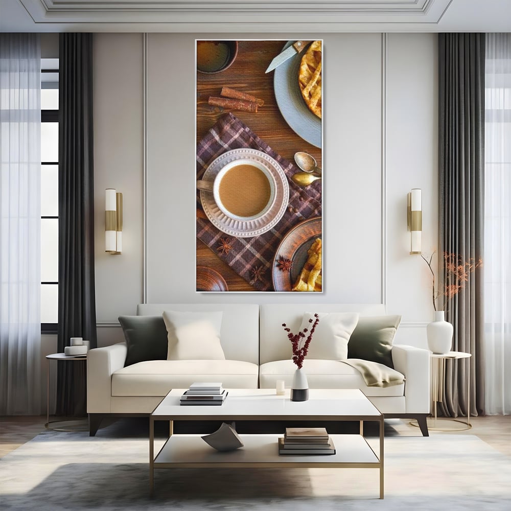 Tablou canvas cu natura moarta cu cafea si placinta, in rama de aluminiu argintiu, pe perete intr-un living